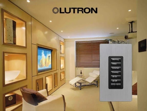 Lutron showroom display featuring a modern living space with wood cabinetry, recessed lighting, and a control panel with multiple switches on the wall.